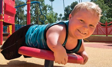 child playing on playground equipment