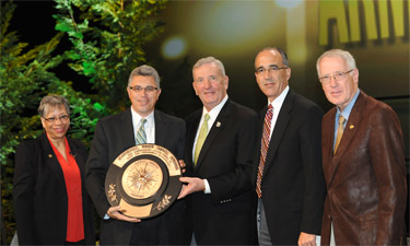 Gen. Tommy Franks presents the first-ever Armed Forces Recreation Award to the Morale, Welfare, and Recreation Department, Naval Station Great Lakes, Illinois.