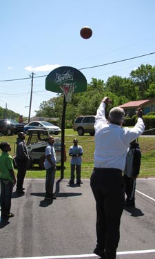 Birmingham Mayor William Bell joins in a game of HORSE on a newly refreshed court.