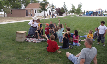 A school program meets near the Boundless playground in Boardwalk Park.