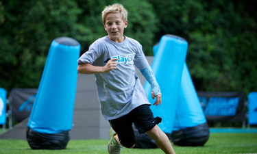 One of dozens of young attendees explores the KidZone at its September 2013 unveiling.