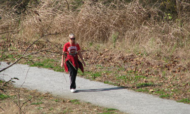 Trail maintenance crews can increase safety for trail users by reducing dense vegetation along pathways, which provides cover for visitors with malicious intent.