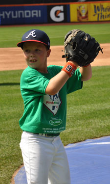 Eight-year-old Banks Hartman prepares to pitch during Fuquay-Varina, North Carolina’s local Pitch, Hit and Run competition.