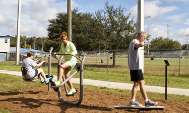 Visitors at the Jervey Gantt Recreational Complex Trail in Ocala, Florida, can work out using new fitness equipment designed by GameTime.