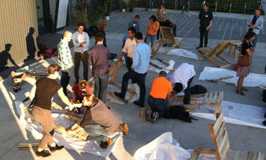 Chairbombing activists in Boston turn discarded wooden pallets into chairs that are later placed in public spaces.