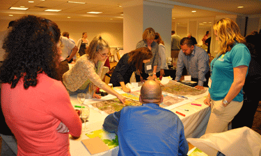 Innovation Lab attendees participate in an exercise to reimagine a section of Miami’s Liberty City in terms of health, equity and access.