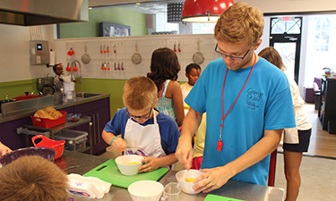 Children are more likely to eat fresh fruits and vegetables and hot meals, than processed foods, which can help to reduce food waste.